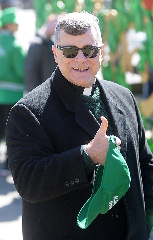 Father Joseph Rogliano, of St. Mark School, is all smiles during the City of Buffalo Annual St. Patrick's Day Parade on Delaware Avenue. (Dan Cappellazzo/Staff Photographer)